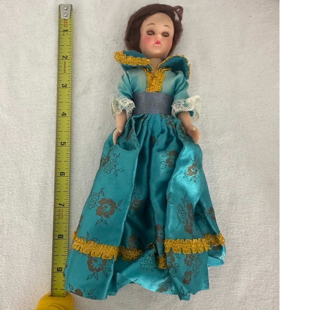 Old doll with sleepy eyes, blue‎ & gold dress vintage